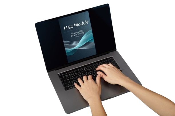 A dark gray laptop with a black keyboard and screen, shown from an overhead angle on a white background. A pair of hands is typing on the keyboard.